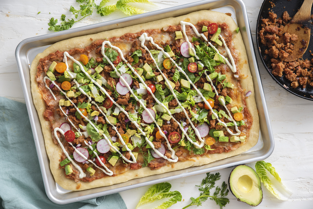 Pizza con insalata di tacos